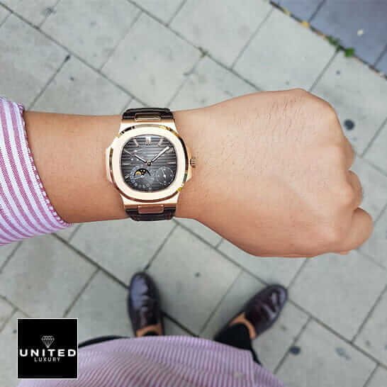 Patek Philippe Rose Gold Case Black Dial Leather Bracelet Replica on the man wrist